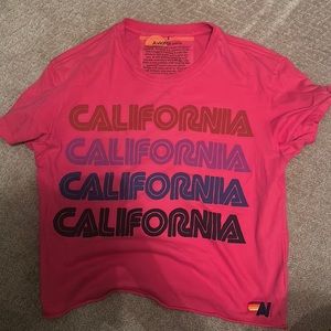 Women’s size small Aviator Nation tee shirt, in pink.